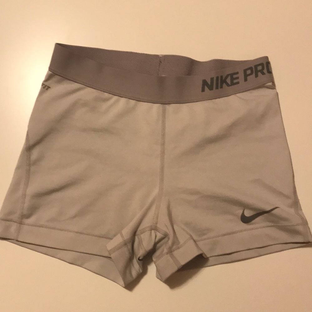 White and grey women’s Nike spandex